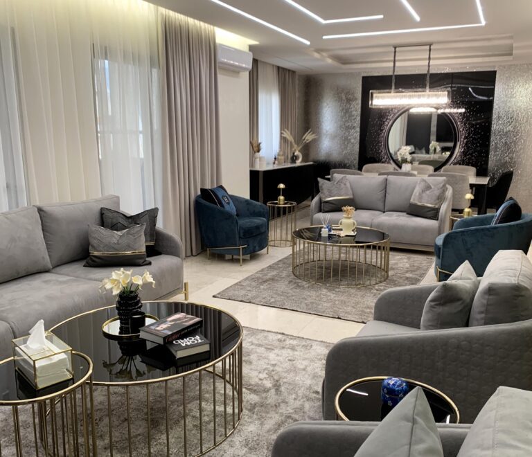 Luxury Living: a pic of the interoir showcasing a luxury salon in the front and an equally luxurious dining area in the background