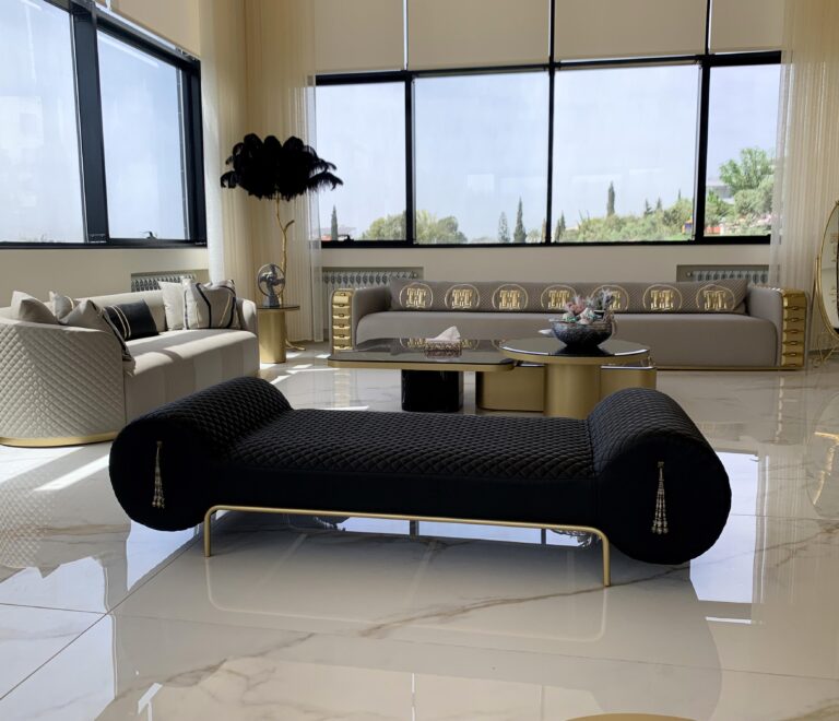Second seater area with a 4.5-seater greige Napoleon sofa, another 2-seater beige sofa, black bench, and the feather floor lamp