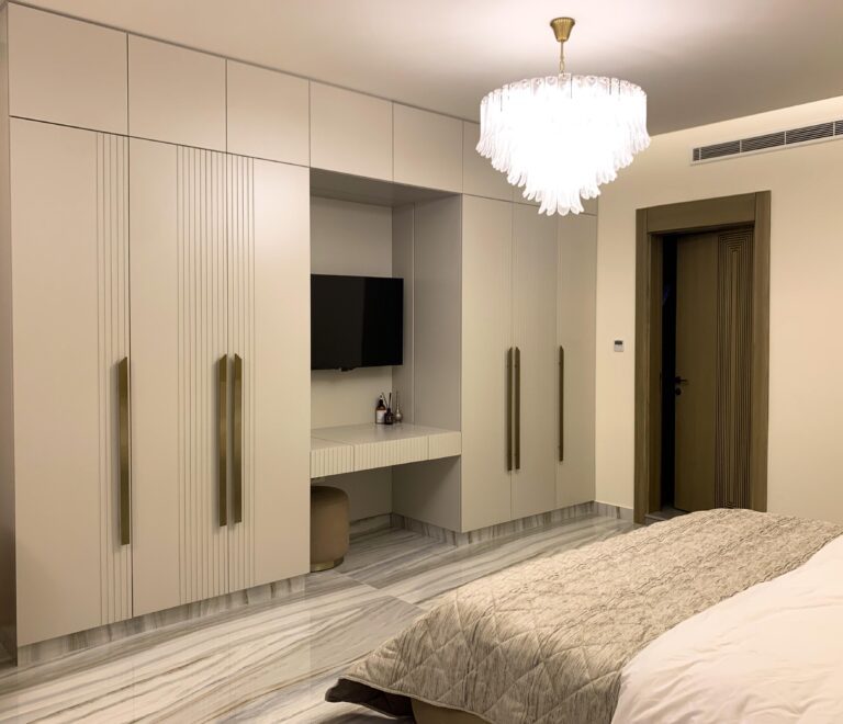 Main closet of the master bedroom with built in TV facing the bed