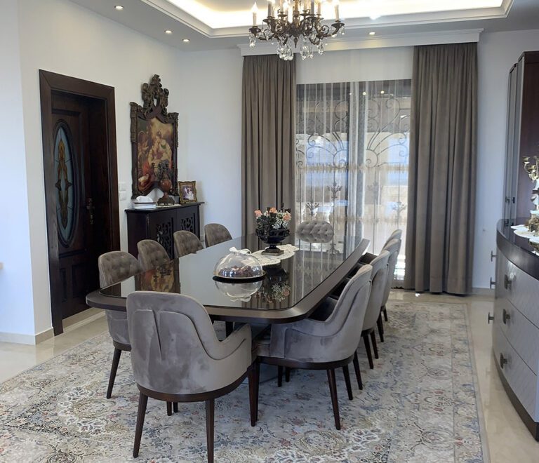 The dining table with its velvet fabric dining chairs